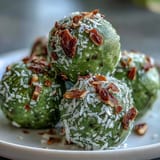 Wholesome no-bake matcha coconut energy balls featuring oats, perfect for a quick pick-me-up any time of day.  
