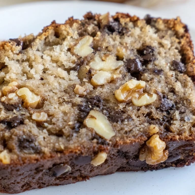 Freshly baked American banana bread, with optional walnuts, perfect with coffee for breakfast.