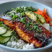 Vibrant 15-minute teriyaki salmon bowl with glazed salmon, fresh vegetables, and fluffy jasmine rice.  